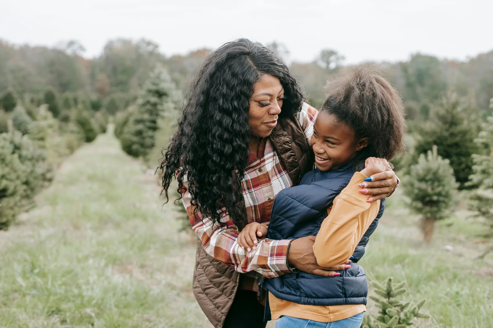 A mom embracing her daughter with love